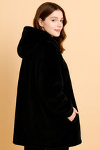 melo black heated hoodie blanket worn indoors for cosy winter comfort