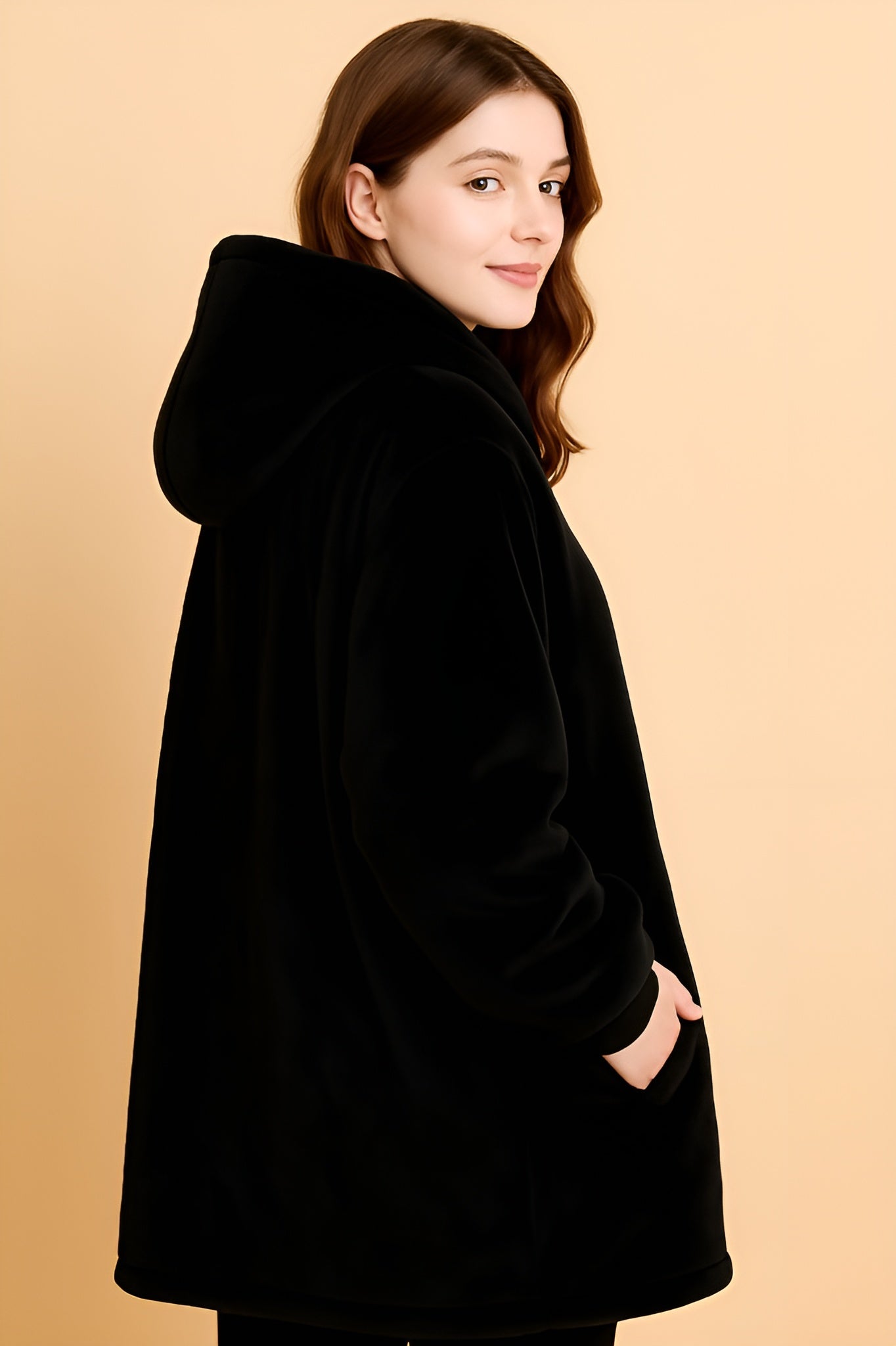 melo black heated hoodie blanket worn indoors for cosy winter comfort