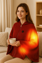Woman wearing a red Melo USB heated throw blanket holding a mug in a cozy living room.