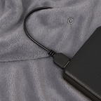 Portable Melo electric warming throw blanket connected to a USB power source.
