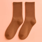 Coffee-brown Melo plush cozy socks, ideal for lounging at home.