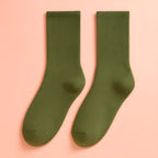 Green Melo plush winter socks with breathable cotton blend and plush lining.