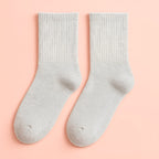 Light grey Melo plush winter socks with thick, warm inner pile.