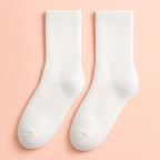 White Melo plush winter socks with soft cushioned interior for all-day comfort.