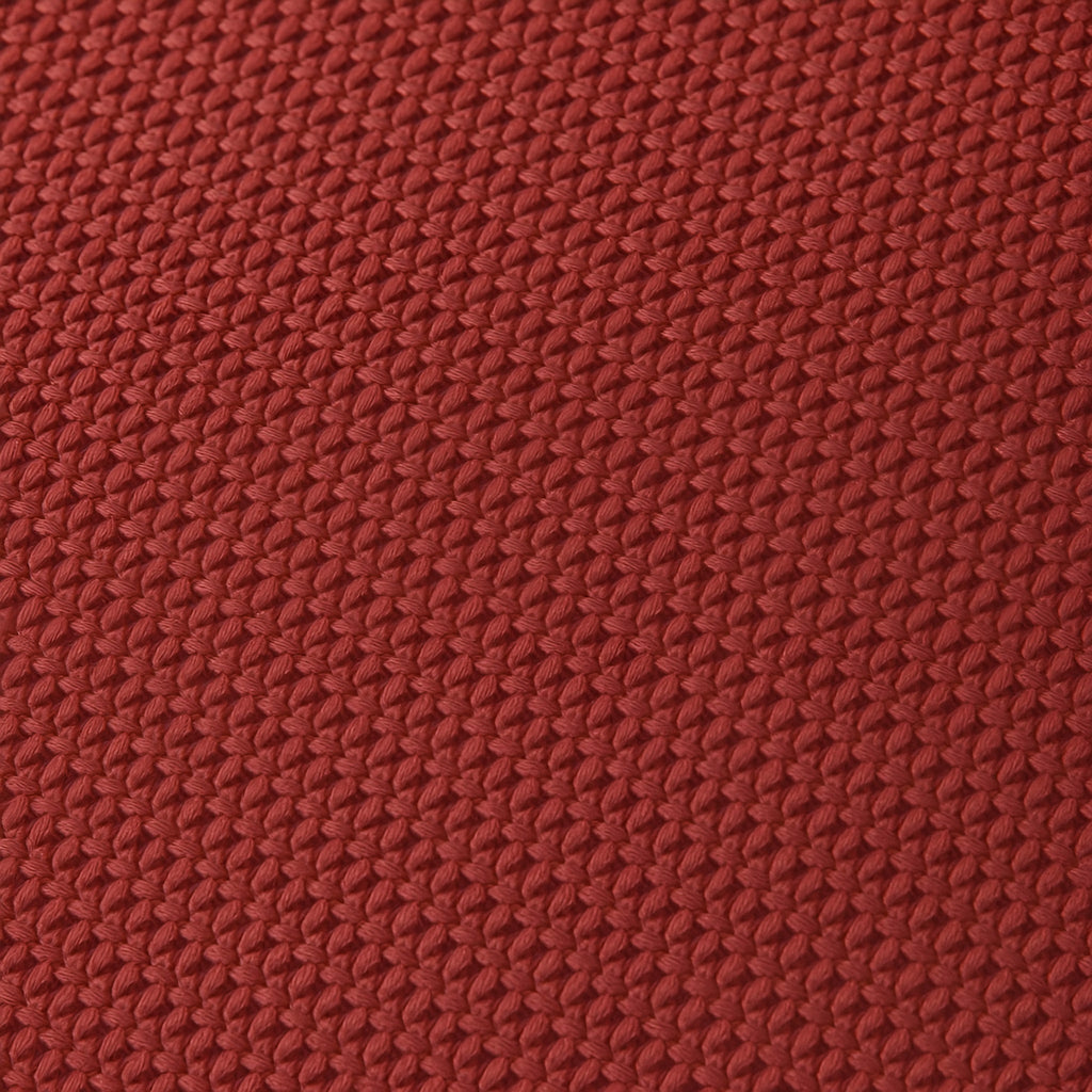 Close-up of a textured red fabric surface