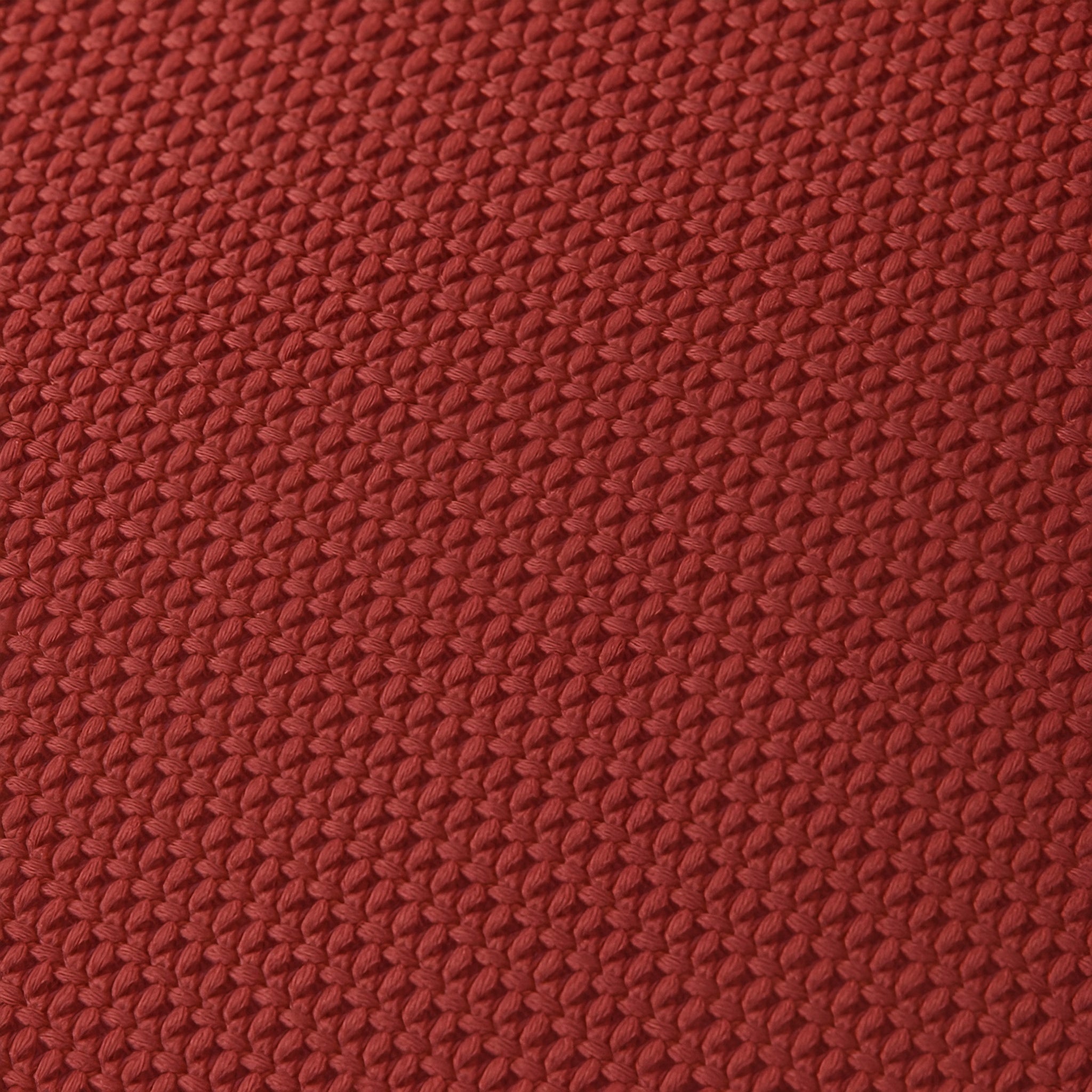 Close-up of a textured red fabric surface